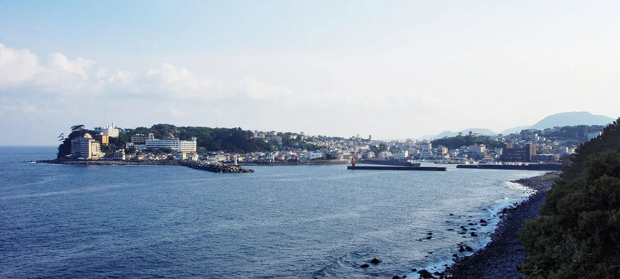 Inatori peninsula and waterfront onsen hotels viewed across the sea