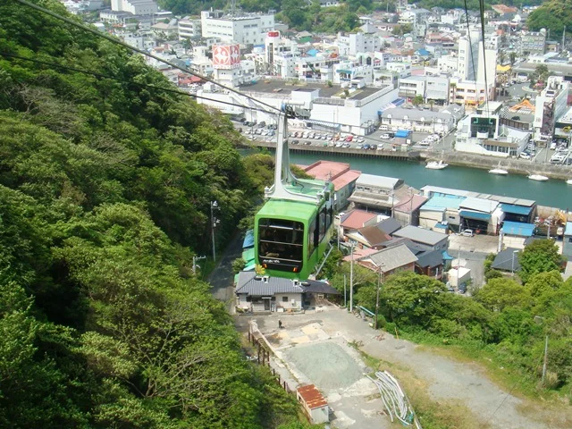 Shimoda Ropeway gondola on the wooded hillside, photographed in May 2011