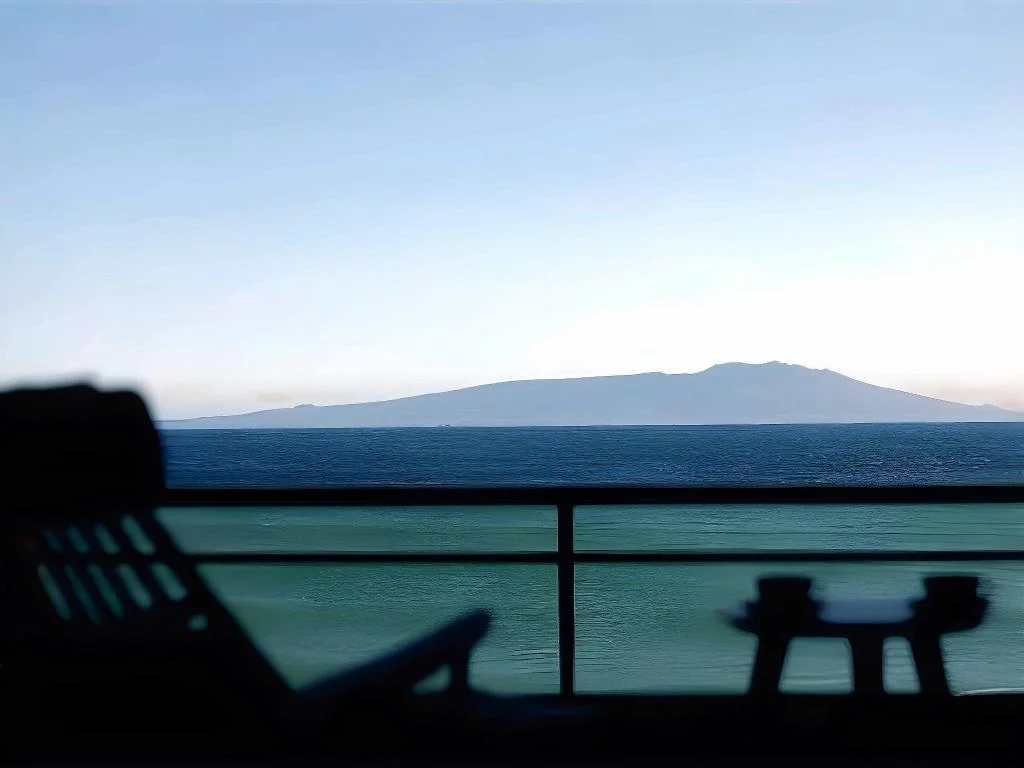 Seafront balcony with an island on the horizon at Atagawakan Hotel
